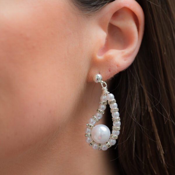 Rosa sløyfe-øredobber, designet av Pearl Octopuss.y